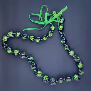 Excellent condition, worn once, got in Hawaii, black, green, yellow & white